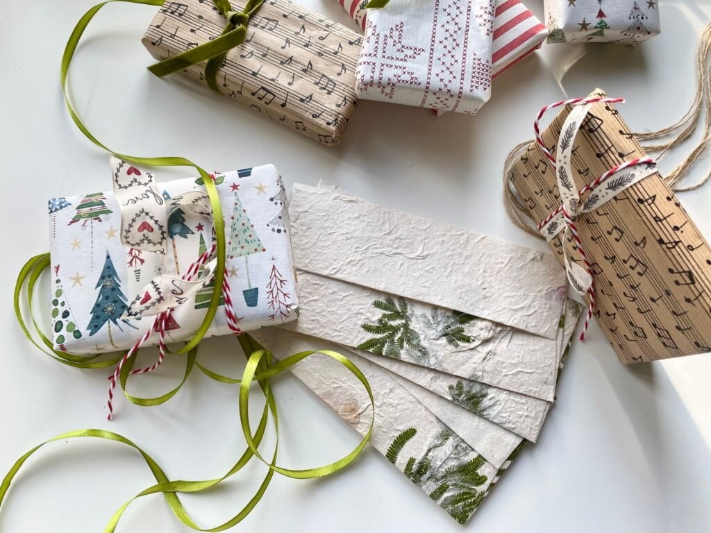 Christmas presents wrapped in patterned paper with ribbons and tags